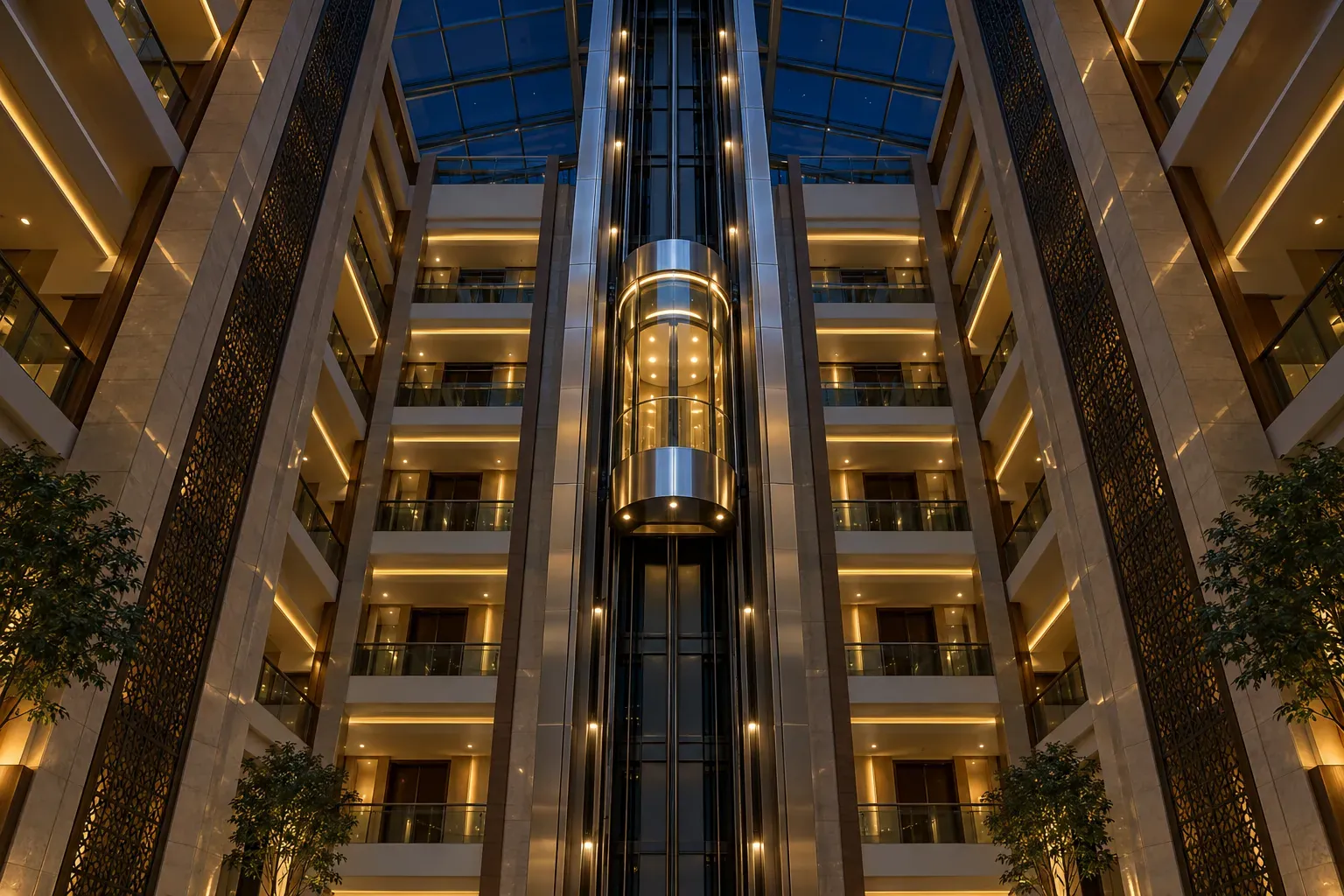 Glass capsule lift travelling through a tall illuminated atrium