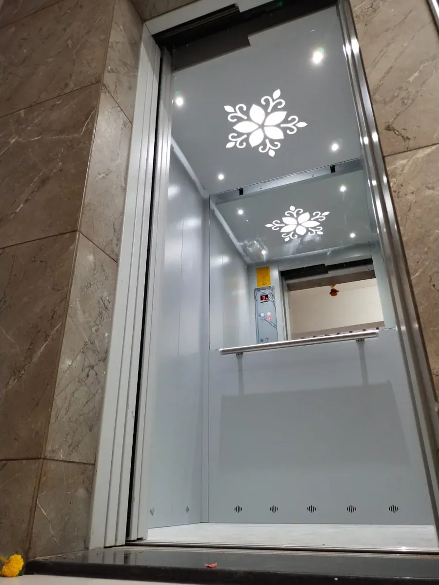 Light-grey compact cabin with floral cut-out ceiling lights