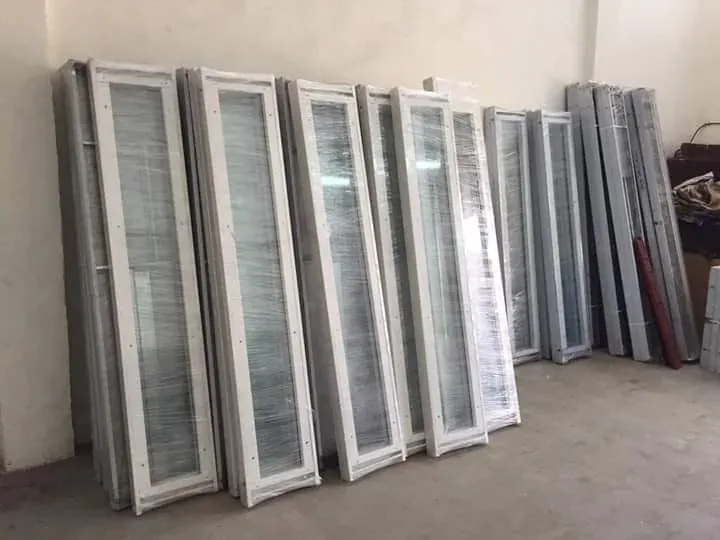 Elevator landing door panels stacked at the workshop