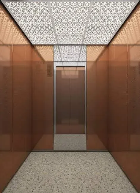 Copper-tone cabin with a patterned white ceiling and terrazzo floor